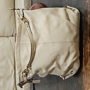 Cream colored Coach purse
